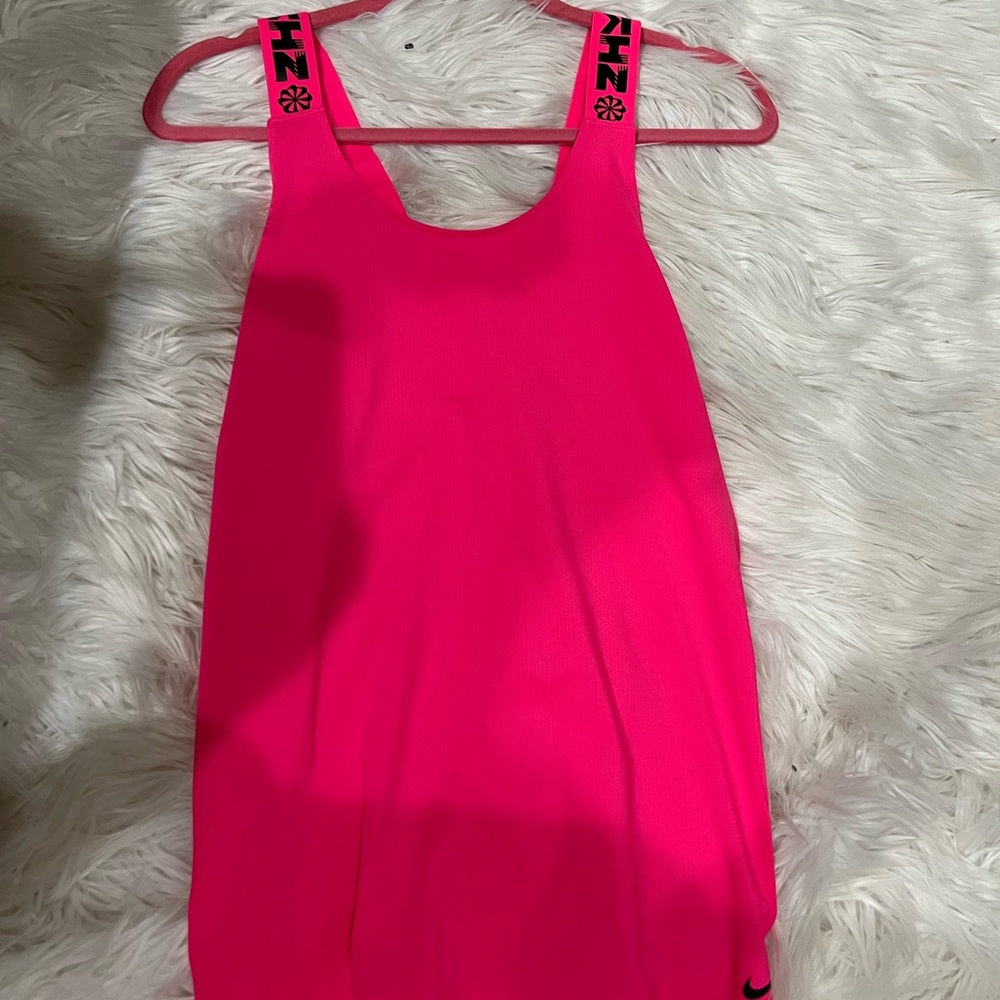 vibrant pink Nike workout top